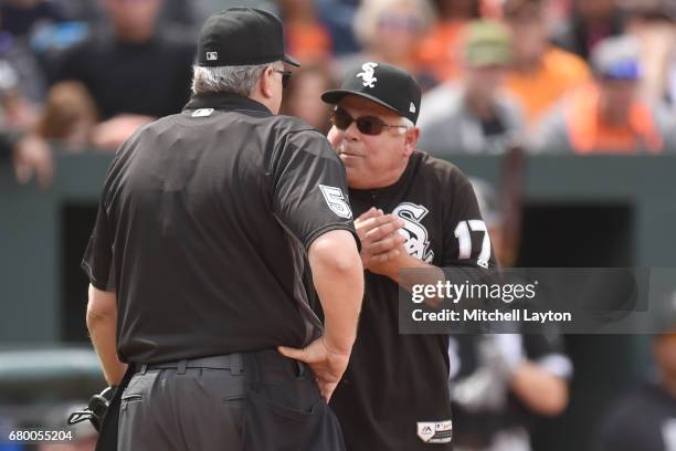 Manager Rick Renteria of the Chicago White Sox argues with umpire Paul Emmel after getting thrown out of game in the third inning during a baseball...