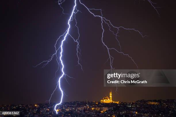 Fatih Mosque is seen as lightning strikes over the Istanbul skyline during a thunderstorm on May 7, 2017 in Istanbul, Turkey.