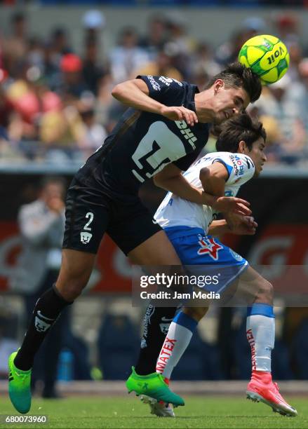 Jose Carlos Van Rankin of Pumas fights for the ball with Carlos Orrantia of Puebla during the 17th round match between Pumas UNAM and Puebla as part...