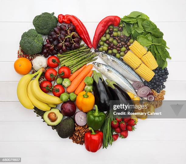 heart healthy mediterranean diet in heart-shape. - alimentazione sana foto e immagini stock