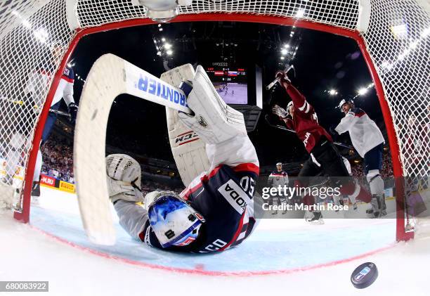 Miks Indrasis of Latvia celebrates the opening goal during the 2017 IIHF Ice Hockey World Championship game between Latvia and Slovakia at Lanxess...