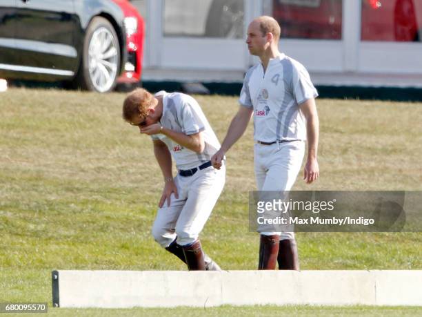 Prince Harry and Prince William, Duke of Cambridge after taking part in the Audi Polo Challenge at Coworth Park Polo Club on May 7, 2017 in Ascot,...