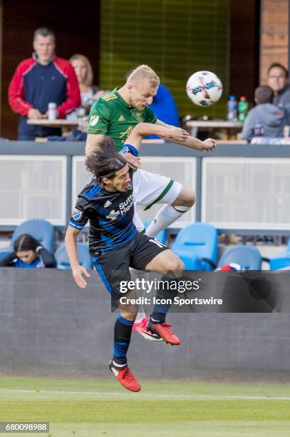 San Jose Earthquakes midfielder Jahmir Hyka and Portland Timbers defender Vytautas Andriuskevicius fight in the air during the Major League Soccer...