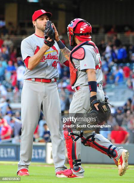 Kevin Siegrist and Yadier Molina of the St. Louis Cardinals celebrate after the game against the Atlanta Braves at SunTrust Park on May 7, 2017 in...