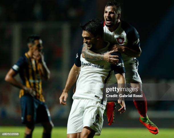 Matias Caruzzo of San Lorenzo celebrates with teammate Franco Mussis after scoring the second goal of his team during a match between San Lorenzo and...