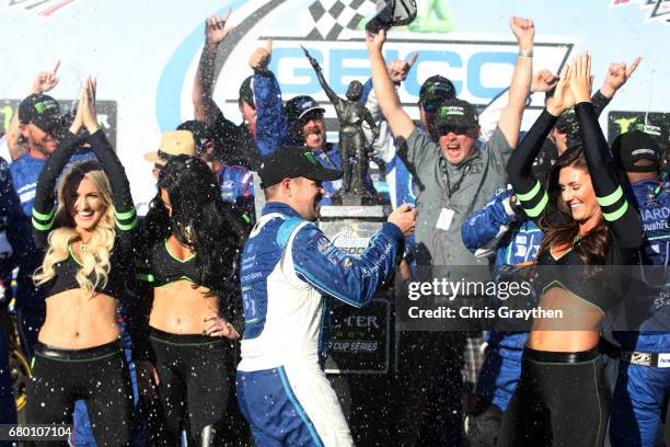 Ricky Stenhouse Jr., driver of the Fifth Third Bank Ford, celebrates with champagne in Victory Lane after winning the Monster Energy NASCAR Cup...
