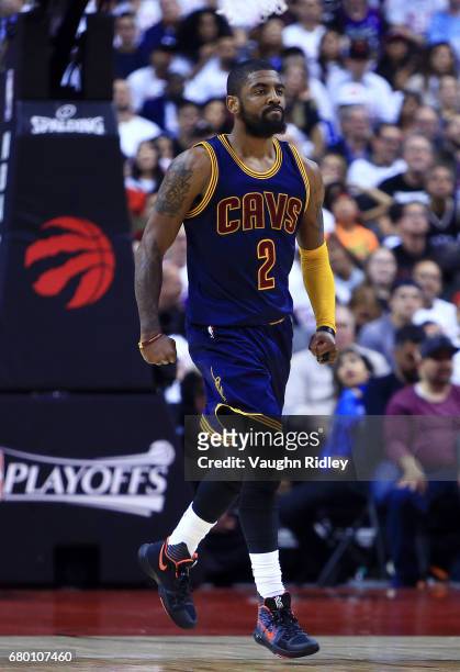Kyrie Irving of the Cleveland Cavaliers reacts after sinking a basket in the second half of Game Four of the Eastern Conference Semifinals against...