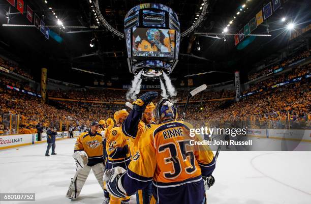 Austin Watson congratulates Pekka Rinne of the Nashville Predators after a 3-1 win against the St. Louis Blues in Game Six of the Western Conference...