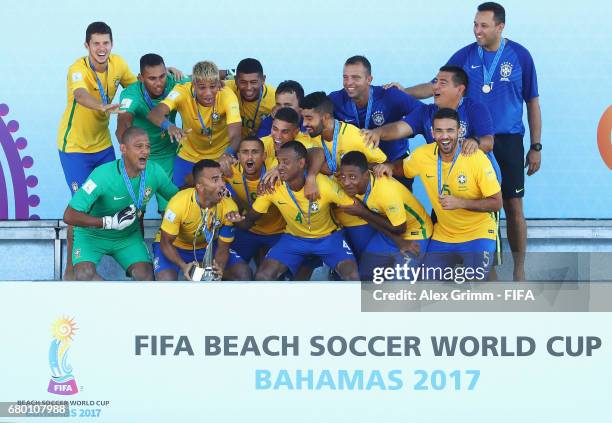 Players of Brazil celebrate with the trophy after winning the FIFA Beach Soccer World Cup Bahamas 2017 final between Tahiti and Brazil at National...