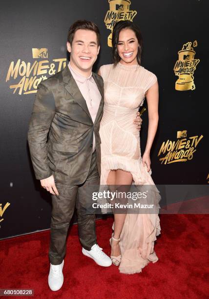 Host Adam DeVine and actor Chloe Bridges attend the 2017 MTV Movie And TV Awards at The Shrine Auditorium on May 7, 2017 in Los Angeles, California.