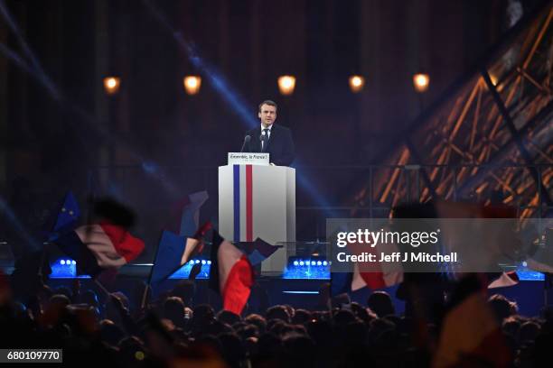 Leader of 'En Marche !' Emmanuel Macron speaks to supporters after winning the French Presidential Election, at The Louvre on May 7, 2017 in Paris,...