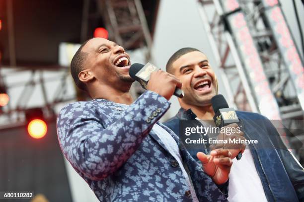 Professional football player Victor Cruz, left, and former professional football player Shawne Merriman attend the 2017 MTV Movie And TV Awards...