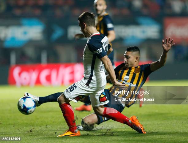 Bautista Merlini of San Lorenzo fights for the ball with Victor Salazar of Rosario Central during a match between San Lorenzo and Rosario Central as...