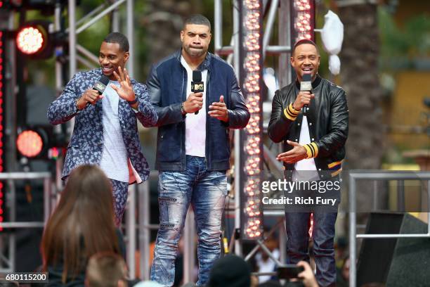 Professional football player Victor Cruz, former professional football player Shawne Merriman and television personality Terrence J attend the 2017...