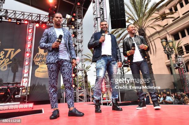 Professional football player Victor Cruz, former professional football player Shawne Merriman and television personality Terrence J attend the 2017...