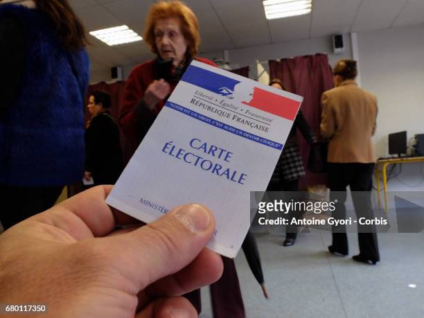 Voters go to the polls in the second round of voting for President, between candidates Marine Le Pen and Emmanuel Macron, on May 7, 2017 in PARIS,...