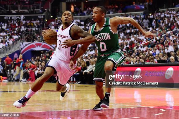 Bradley Beal of the Washington Wizards dribbles the ball against Avery Bradley of the Boston Celtics in the first quarter in Game Four of the Eastern...