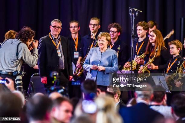 German Chancellor and Chairwoman of the German Christian Democrats Angela Merkel looks on during the CDU campaign rally for state elections in North...
