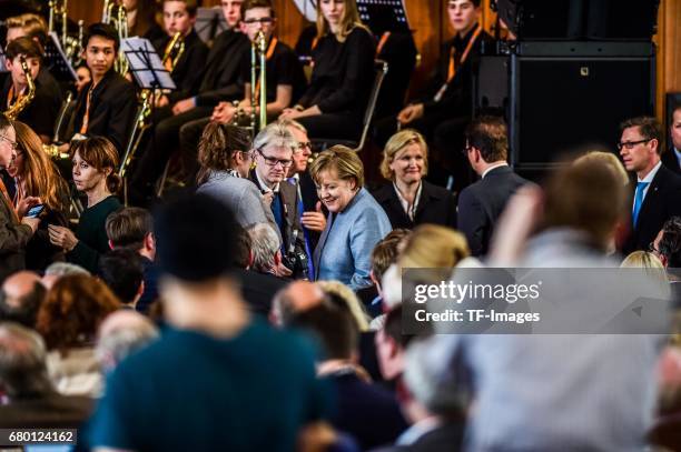 German Chancellor and Chairwoman of the German Christian Democrats Angela Merkel looks on during the CDU campaign rally for state elections in North...