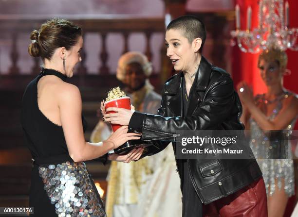 Actor Emma Watson accepts the Best Actor in a Movie award for 'Beauty and the Beast' from actor Asia Kate Dillon onstage during the 2017 MTV Movie...
