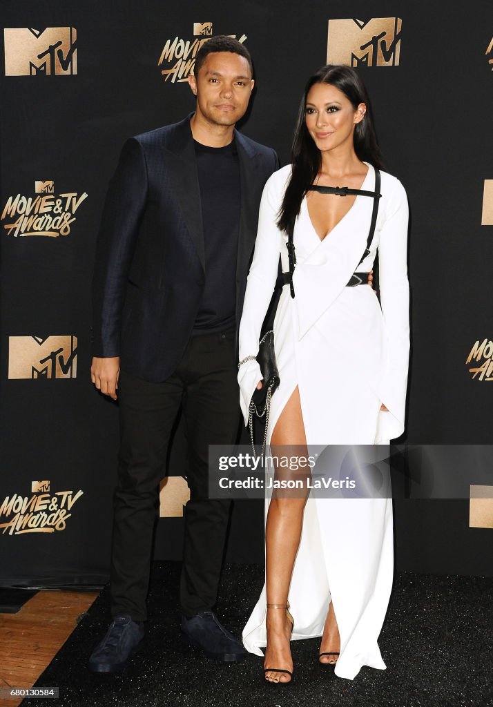 Trevor Noah and Jordyn Taylor pose in the press room at the 2017 MTV