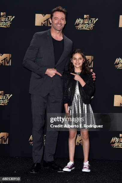 Actors Hugh Jackman and Dafne Keen, winners of Best Duo for 'Logan', pose in the press room during the 2017 MTV Movie And TV Awards at The Shrine...