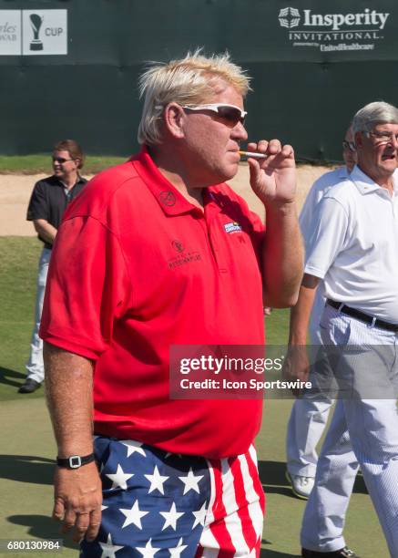 John Daly prepares to receive the champion's trophy after winning the Insperity Invitational final round play on May 7, 2017 at The Woodlands Country...