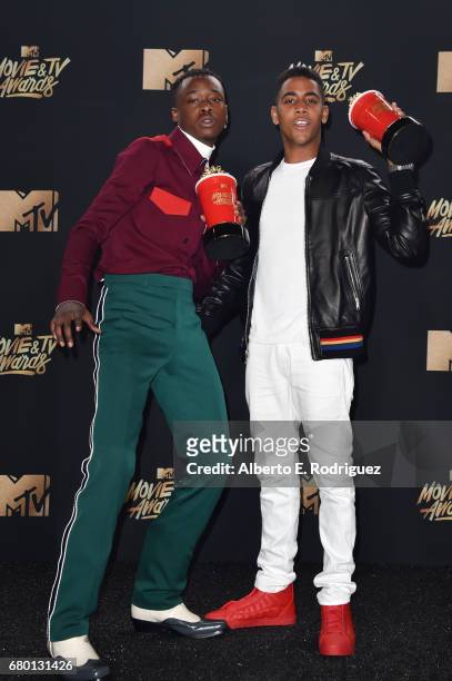Actors Ashton Sanders and Jharrel Jerome, winners of Best Kiss for 'Moonlight', pose in the press room during the 2017 MTV Movie And TV Awards at The...