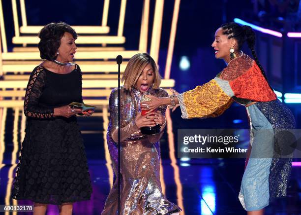 Actor Taraji P. Henson accepts the Best Fight Against The System award for 'Hidden Figures' from U.S. Representative Maxine Waters and actor Tracee...