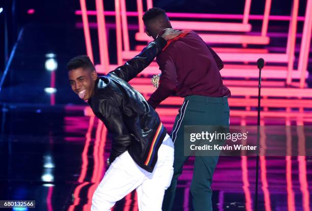 Actors Jharrel Jerome and Ashton Sanders accept Best Kiss for 'Moonlight' onstage during the 2017 MTV Movie And TV Awards at The Shrine Auditorium on...