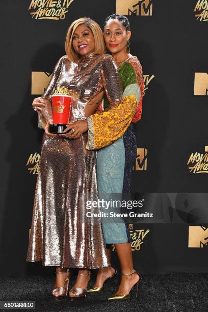 Actors Tracee Ellis Ross and Taraji P. Henson, winner of Best Fight Against the System for 'Hidden Figures', pose in the press room at the 2017 MTV...