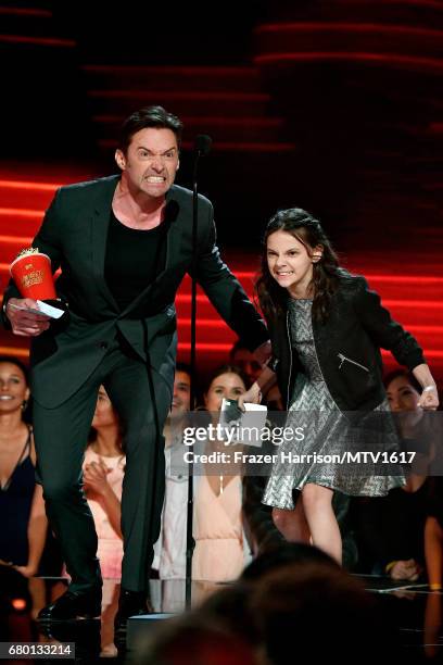 Actors Hugh Jackman and Dafne Keen, winners of Best Duo for 'Logan', accept award onstage during the 2017 MTV Movie And TV Awards at The Shrine...