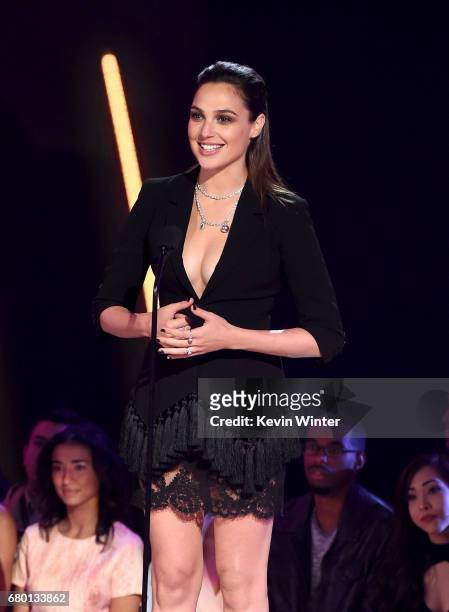 Actor Gal Gadot speaks onstage during the 2017 MTV Movie And TV Awards at The Shrine Auditorium on May 7, 2017 in Los Angeles, California.