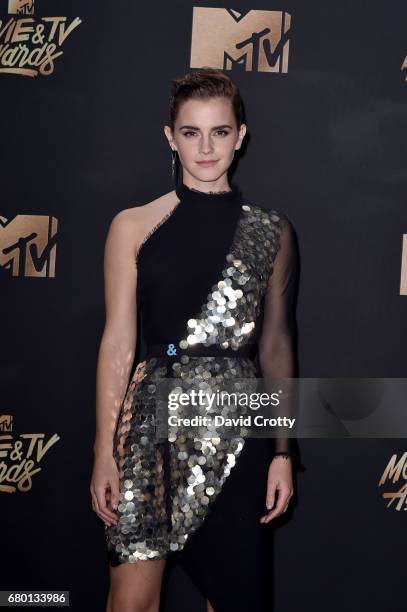Actor Emma Watson, winner of the Best Actor in a Movie award for 'Beauty and the Beast', poses in the press room during the 2017 MTV Movie And TV...