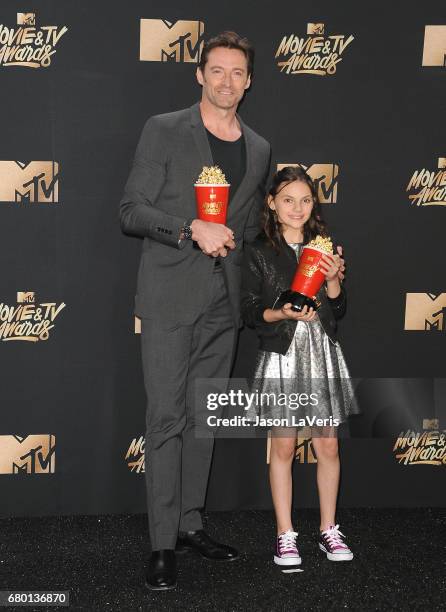 Hugh Jackman and Dafne Keen poses in the press room at the 2017 MTV Movie and TV Awards at The Shrine Auditorium on May 7, 2017 in Los Angeles,...