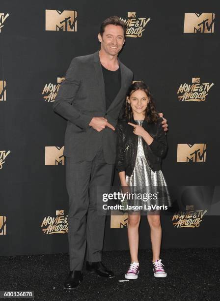 Hugh Jackman and Dafne Keen poses in the press room at the 2017 MTV Movie and TV Awards at The Shrine Auditorium on May 7, 2017 in Los Angeles,...
