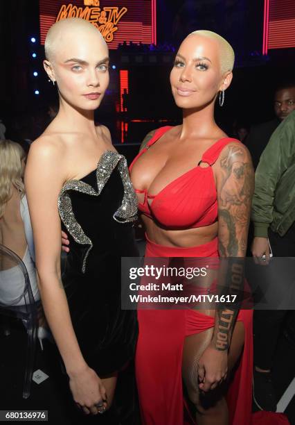 Models Cara Delevingne and Amber Rose attend the 2017 MTV Movie And TV Awards at The Shrine Auditorium on May 7, 2017 in Los Angeles, California.