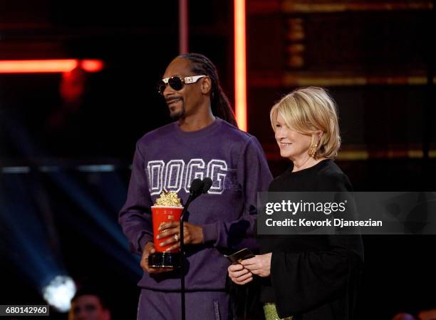 Rapper Snoop Dogg and Martha Stewart speak onstage during the 2017 MTV Movie And TV Awards at The Shrine Auditorium on May 7, 2017 in Los Angeles,...