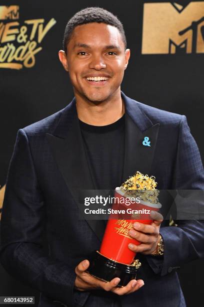 Personality Trevor Noah poses with award for Best Host for 'The Daily Show' in the press room at the 2017 MTV Movie and TV Awards at The Shrine...