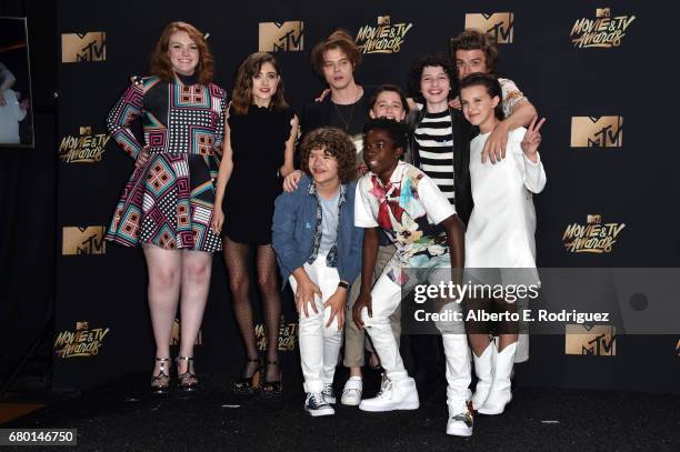 Cast of 'Stranger Things', winner of the Show of the Year award, poses in the press room during the 2017 MTV Movie And TV Awards at The Shrine...