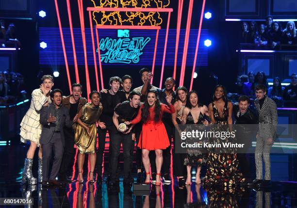 Actors Dylan Minnette and Katherine Langford with the cast of '13 Reasons Why' speak onstage during the 2017 MTV Movie And TV Awards at The Shrine...