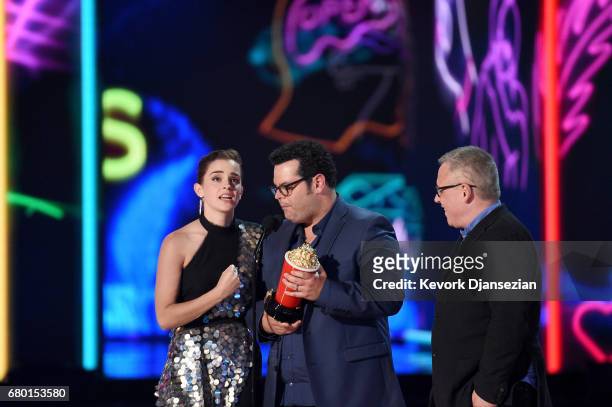 Actors Emma Watson and Josh Gad and director Bill Condon onstage during the 2017 MTV Movie And TV Awards at The Shrine Auditorium on May 7, 2017 in...