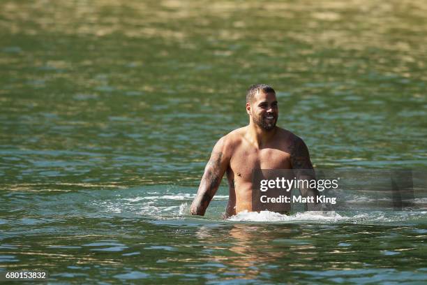 Lance Franklin cool his legs during a Sydney Swans AFL recovery session at Redleaf Beach on May 8, 2017 in Sydney, Australia.