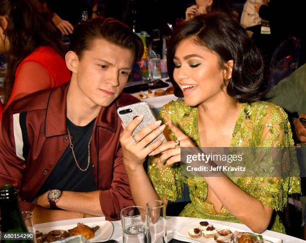 Actors Tom Holland and Zendaya attend the 2017 MTV Movie And TV Awards at The Shrine Auditorium on May 7, 2017 in Los Angeles, California.