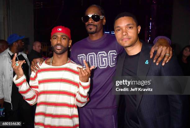 Rappers Big Sean, Snoop Dogg and comedian Trevor Noah attend the 2017 MTV Movie And TV Awards at The Shrine Auditorium on May 7, 2017 in Los Angeles,...