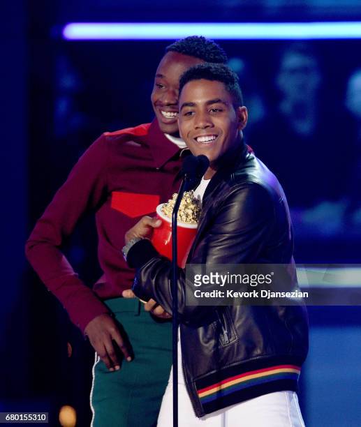 Actors Ashton Sanders and Jharrel Jerome accept Best Kiss for 'Moonlight' onstage during the 2017 MTV Movie And TV Awards at The Shrine Auditorium on...
