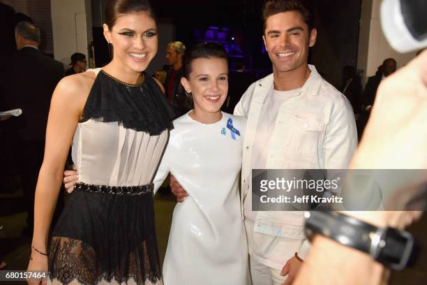 Actors Alexandra Daddario, Millie Bobby Brown and Zac Efron attend the 2017 MTV Movie And TV Awards at The Shrine Auditorium on May 7, 2017 in Los...