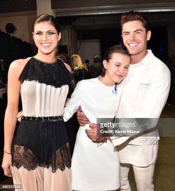 Actors Alexandra Daddario, Millie Bobby Brown, and Zac Efron attend the 2017 MTV Movie And TV Awards at The Shrine Auditorium on May 7, 2017 in Los...