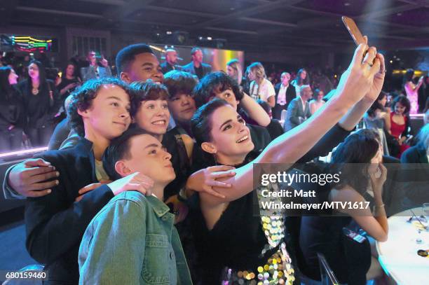 Actor Emma Watchson poses with the cast of "IT" during the 2017 MTV Movie And TV Awards at The Shrine Auditorium on May 7, 2017 in Los Angeles,...