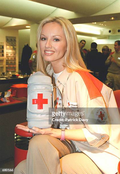 French Red Cross Ambassador Adriana Karembeu presents the new emergency kit of the French Red Cross November 6, 2001 in Paris, France.